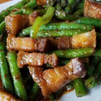 Pik Khing Crispy Pork Belly · Stir fried crispy pork belly in chilled paste, with green bean, basil, bell peppers.