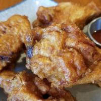 Golden Garlic Wings · Deep fried chicken wings. Served with sweet chili sauce