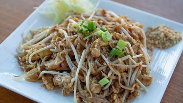 Pad Thai (Traditional Thai Style) · Rice noodles with tamarind sauce, ground peanuts, eggs, green onion and fresh bean sprouts with choice of meat.