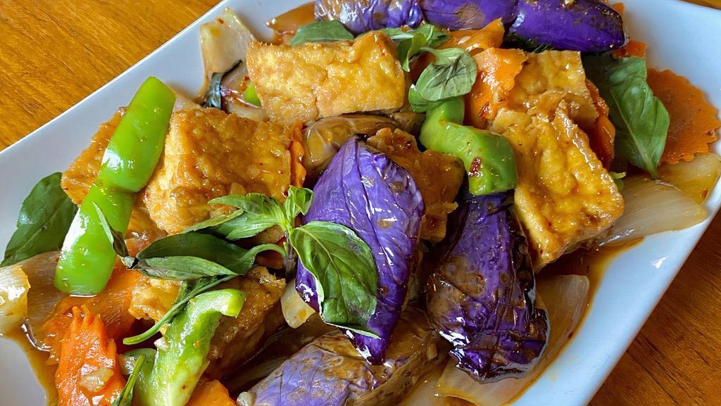 Spicy Eggplant With Tofu · Asian eggplant stir-fried with fried tofu, basil, bell peppers, onions and carrots in bean paste sauce and chili powder. Served with steamed rice