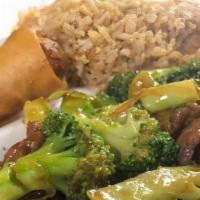 Broccoli Beef · Broccoli sautéed with sliced flank steak stir-fried in a tangy brown sauce.