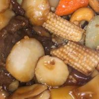 Cashew Beef · Sliced flank steak sautéed with roasted cashews, baby corn, carrots, celery, bamboo shoots, ...