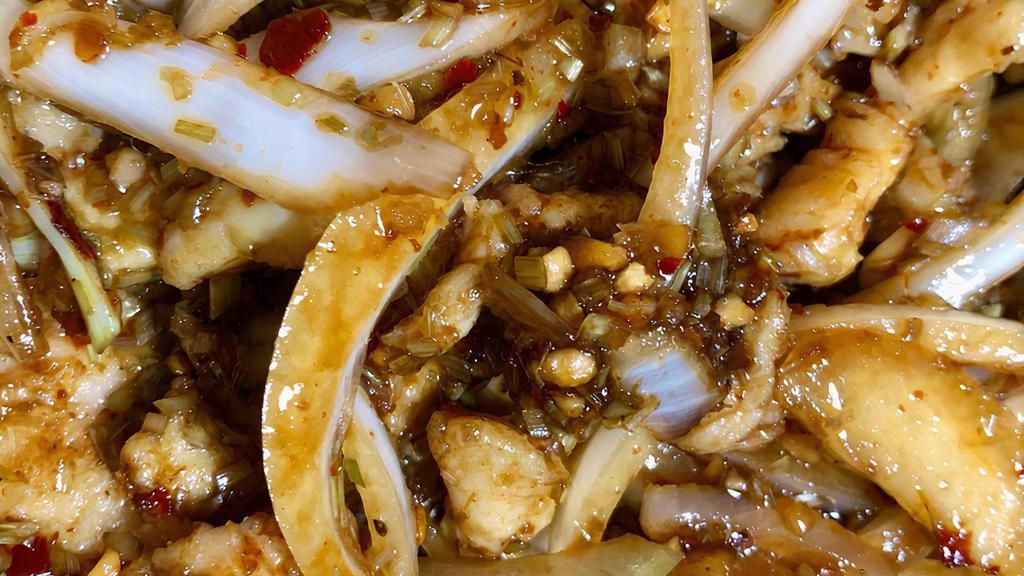 Lemongrass Chicken (Spicy) · Marinated chicken with lemongrass, white onion in a savory soy and oyster sauce with lemon, white and green onion, and chili flakes.