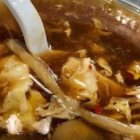 Hot & Sour Soup (Regular - 16Oz) · Hot and fresh broth mixed with bamboo shoots, mushrooms, steamed tofu, and chili flakes.