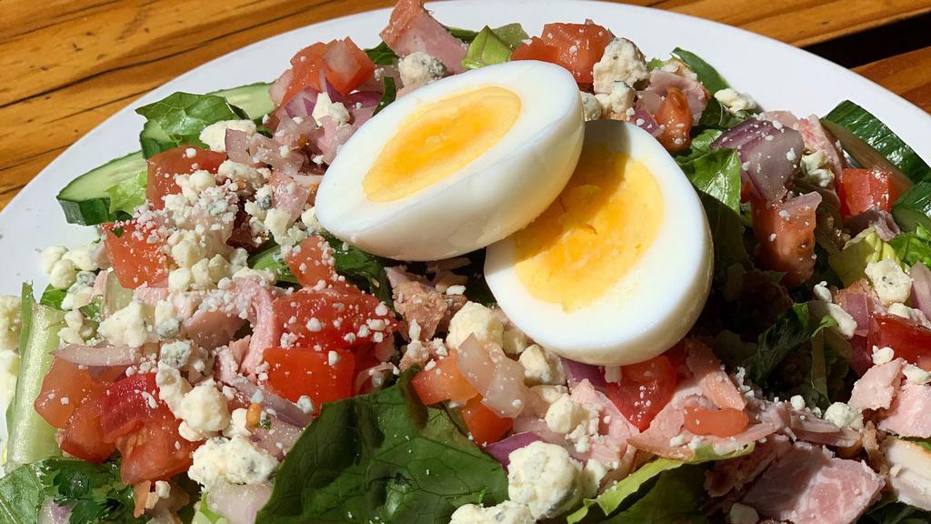Chef Salad · Romaine, bacon, blue cheese crumbles, red onions, carrots, cucumber, tomato, ham, hard-boiled egg.