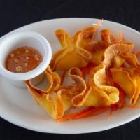 Cream Cheese Wonton (5) · A crispy wonton shell filled with a mouthwatering cream cheese filling. Served with our swee...
