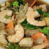 Lad Naa · A unique thai stir fry dish consisting of fresh broccoli, carrots, chinese kale. Smothered i...