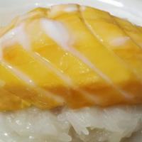 Mango Sticky Rice · Fresh mango sliced and served with sweet rice.