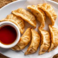 Gyoza (Potstickers) · 8 pieces. Contains pork and vegetables.