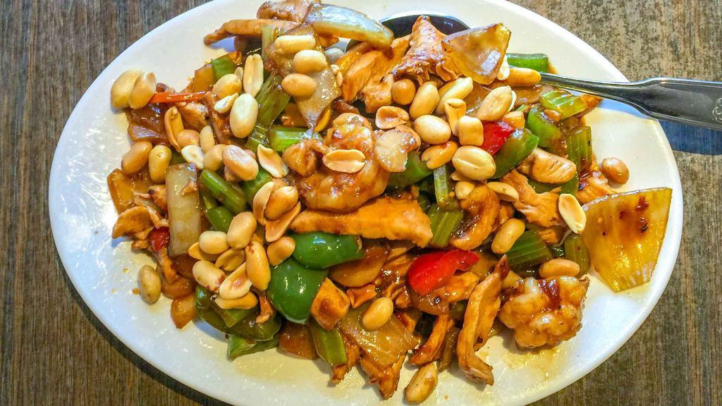 Kung Pao Chicken (Hot) (Lg) · Sliced white chicken cooked with veggies in a hot and spicy kung pao sauce and topped with roasted peanuts.
