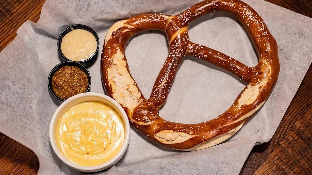 Pretzel · 10 oz Bavarian pretzel served with house-made cheese sauce, honey mustard and stone ground mustard