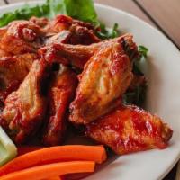 Wings · Fried, crispy, and seasoned with your choice of lemon pepper, Cajun or citrus chili