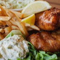 Fish And Chips · Two 6 oz beer-battered fillet served with house slaw, fries, and herbed tartar aioli