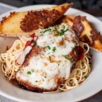 Chicken Parmesan · Fried chicken breast topped with marinara and buffalo mozzarella, served on a bed of pasta w...