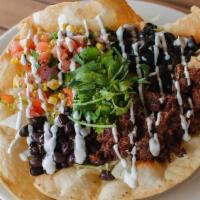 Taco Salad · Fried crispy tortilla shell, filled with salad mix, cheese, olives, black beans, chorizo, so...
