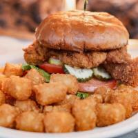 Fried Chicken Sandwich · Breaded and boneless thigh, house-made slaw, lettuce, pickle, tomato, and honey mustard