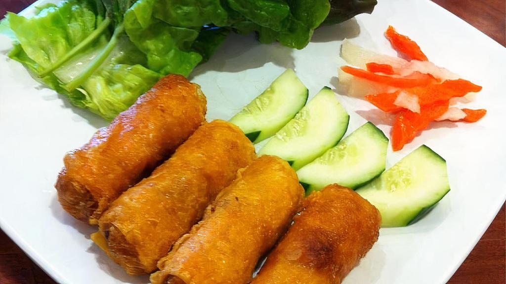 Cha Gid (Crispy Egg Rolls) · Two crispy rolls stuffed with crabmeat, shrimp, pork, salad, and rice vermicelli.