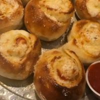 Pepperoni Rolls · 8 pieces. Pepperoni, mozzarella and Parmesan rolled in fresh dough and baked. Served with a ...