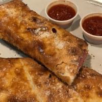 Stromboli · Ham, Genoa salami, pepperoni and provolone. Served with a side of our homemade marinara sauce.