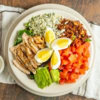 Cobb Salad · Sliced egg, chicken breast, Gorgonzola cheese, avocado, bacon and tomatoes on a bed of fresh...