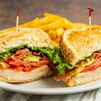 Smoked Turkey And Avocado Sandwich · House smoked turkey, cream cheese, red leaf lettuce, fresh tomatoes, avocado, bacon, and cre...