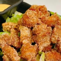 Popcorn Chicken · Fried popcorn chicken with a side of spicy mayo.