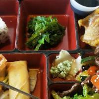 Teriyaki Bento Box · Served with steamed rice, seaweed salad, California roll, tempura, egg roll and cheese wonton.