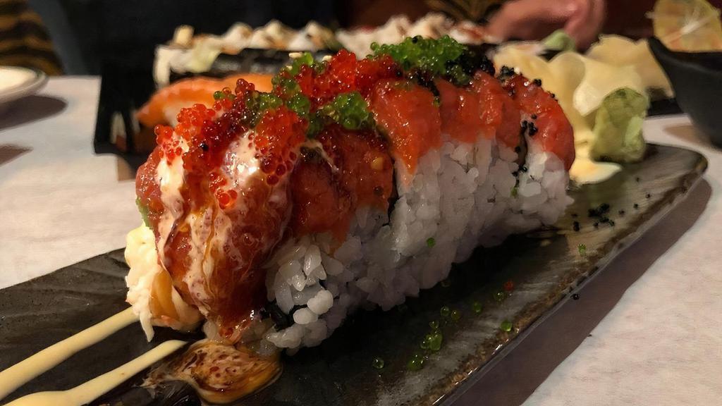 Out Of Control Roll · Salmon, tuna, hamachi, crab, avocado, cucumber and spicy tuna on top with tobiko.