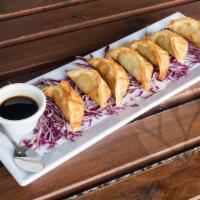 Chicken Pot Stickers (7 Pieces) · A crispy treat of chicken, onions, and garlic, served with our zippy soy-ginger sauce.