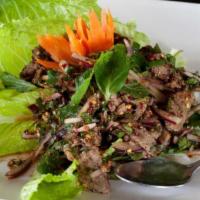 Beef Waterfall Salad 🌶 · Gluten-free, mild spicy. Sliced, hearty flank steak grilled then mixed with a zesty combinat...