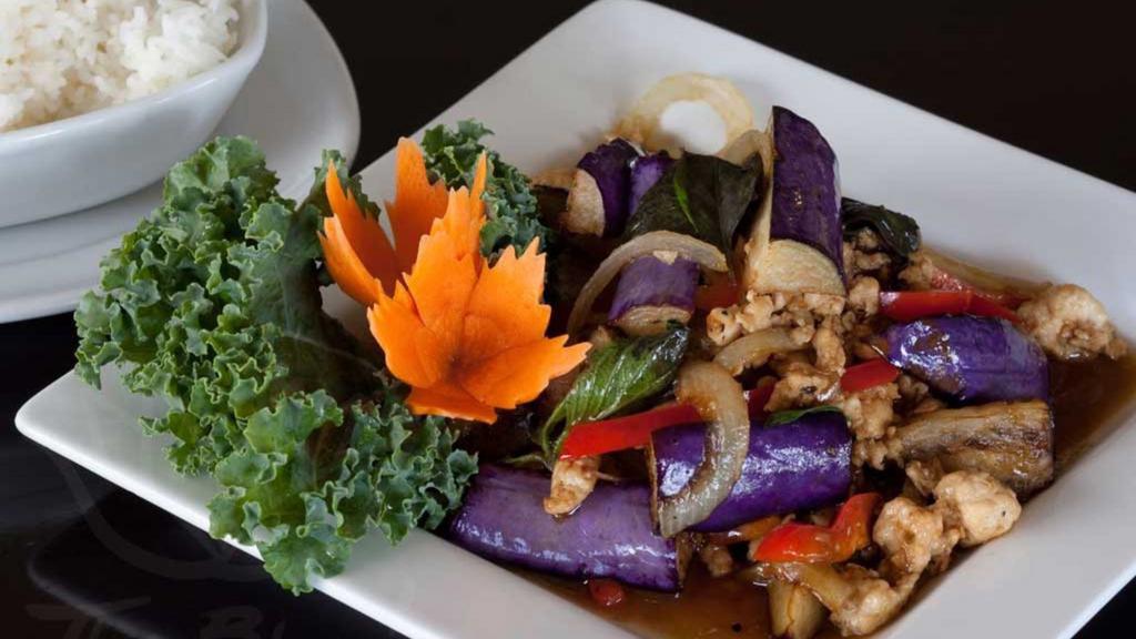 Eggplant Stir-Fry 🌶🌶 · Medium spicy. Fresh Chinese eggplant stir fried with garlic, bell pepper, and onion; served with a tasty basil sauce.