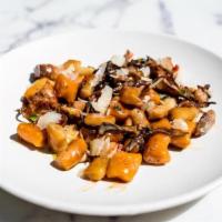 Sweet Potato Gnocchi · Confit pork, mushroom cream, pickled peppers. vegan option
