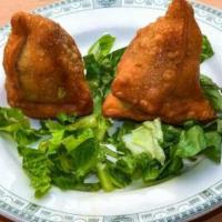 Beef Samosa · Two crispy pastries filled with delicately spiced lean ground beef.