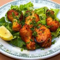 Wings · Spicy chicken wings roasted in the tandoor oven. Served with tamarind and mint chutneys.