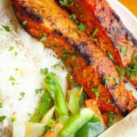 Tandoori Salmon · Savory marinated salmon with saffron, garlic, ginger, and a special blend of spices roasted ...