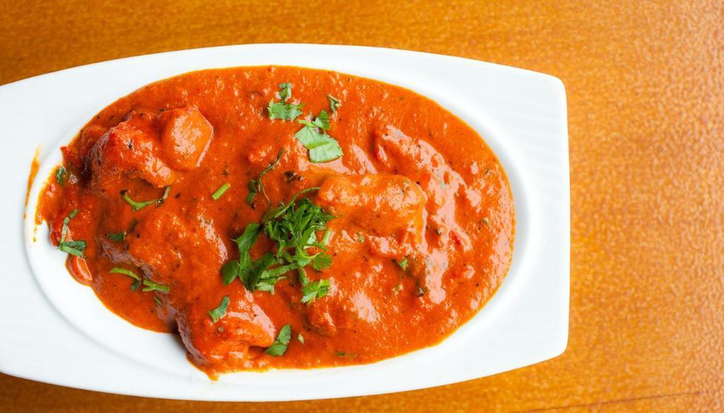 Butter Chicken · Chicken simmered in a rich and smooth butter, tomato, and cream sauce.