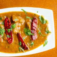Madras Chili Masala Chicken · The dish originates from the city of Madras. Cooked in a sauce of tomatoes, roasted dry chil...