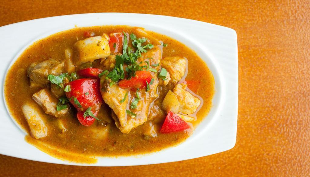 Jalfrazie Fish · Cod fish stir-fried in brown curry with bell peppers, garlic, ginger, tomatoes, and onions.