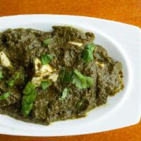 Palak Masala · Cream of spinach simmered with onions and spices.