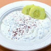 Cucumber Mint Yogurt · Cucumbers mixed with yogurt, mint, olive oil and a touch of garlic.