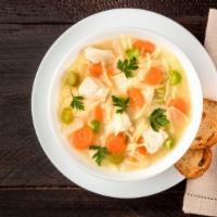 Chicken Noodle Soup · A hearty bowl of classic chicken noodle soup served in a flavorful chicken broth