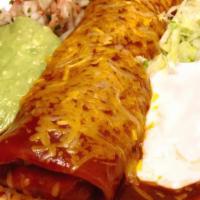 Supreme Burrito · Rolled in a giant fresh hot flour tortilla with enchilada sauce on top, lettuce, sour cream,...