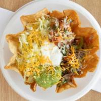 Taco Salad · Crunchy taco bowl served with beans, shredded beef mixed with onions, tomatoes and green bel...