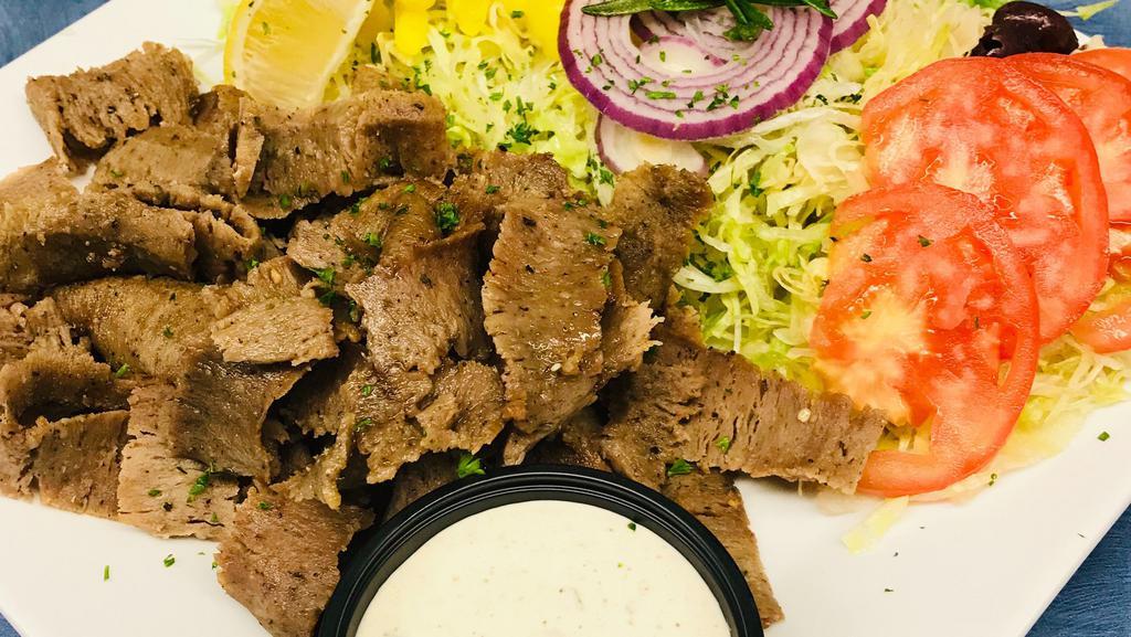 Gyro Platter · A generous portion of thinly sliced gyro meat, lettuce, tomato, red onion, banana peppers, and kalamata olives served with our famous Greek dressing.