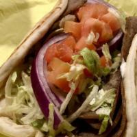 Gyros Classic Delight · Most popular. Lamb and beef or chicken on pita bread, with lettuce, tomatoes, onions, and tz...