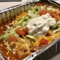 Cheese Enchilada, Smothered Beef Burrito, And Crispy Chile Relleno Combo · Topped with lettuce, cheese, sour cream, tomatoes and smothered with green chili.