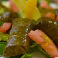 Grape Leaves (6 Pcs) · Grape leaves stuffed with rice, onions, tomatoes, and parsley.