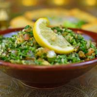 Tabouleh · Finely chopped parsley, mint, tomatoes, onions, mixed with bulgur and our own lemon seasonin...
