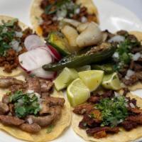 Street Tacos · 2 soft corn tortillas (gluten free) served with your choice of meat, cilantro, onions, limes...