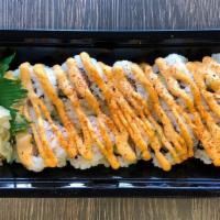 Spicy Salmon Roll · Spicy Salmon, Cucumber, and Avocado rolled in Seaweed with Sushi Rice